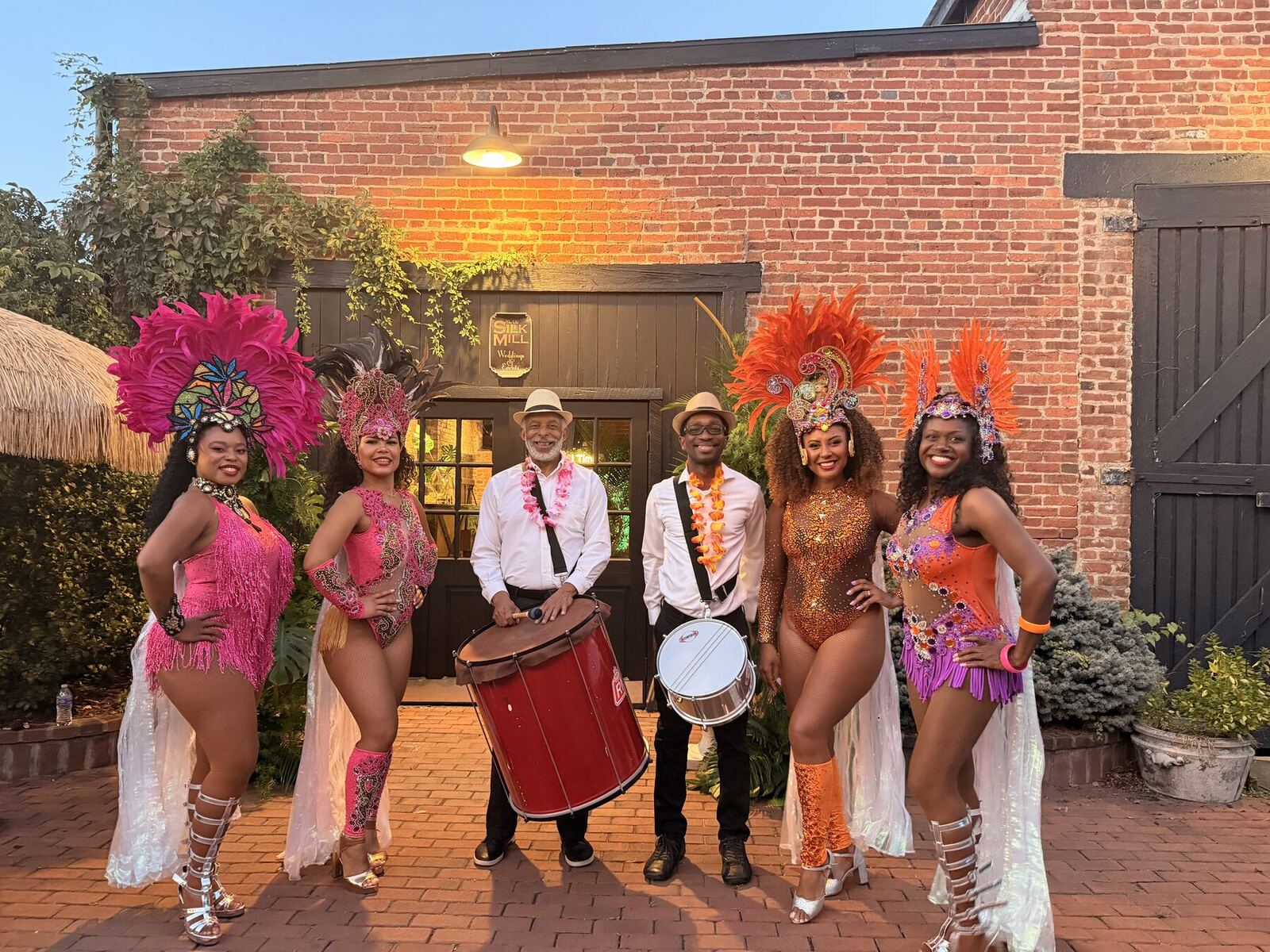 Royalty Samba dancers and drummers at an outdoor celebration