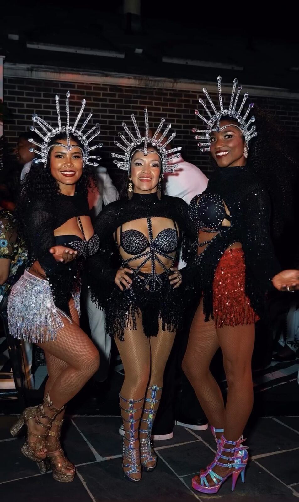 Three Royalty Samba dancers in black jeweled costumes