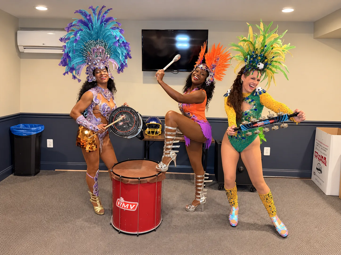 Royalty Samba dancers posing with percussion instruments